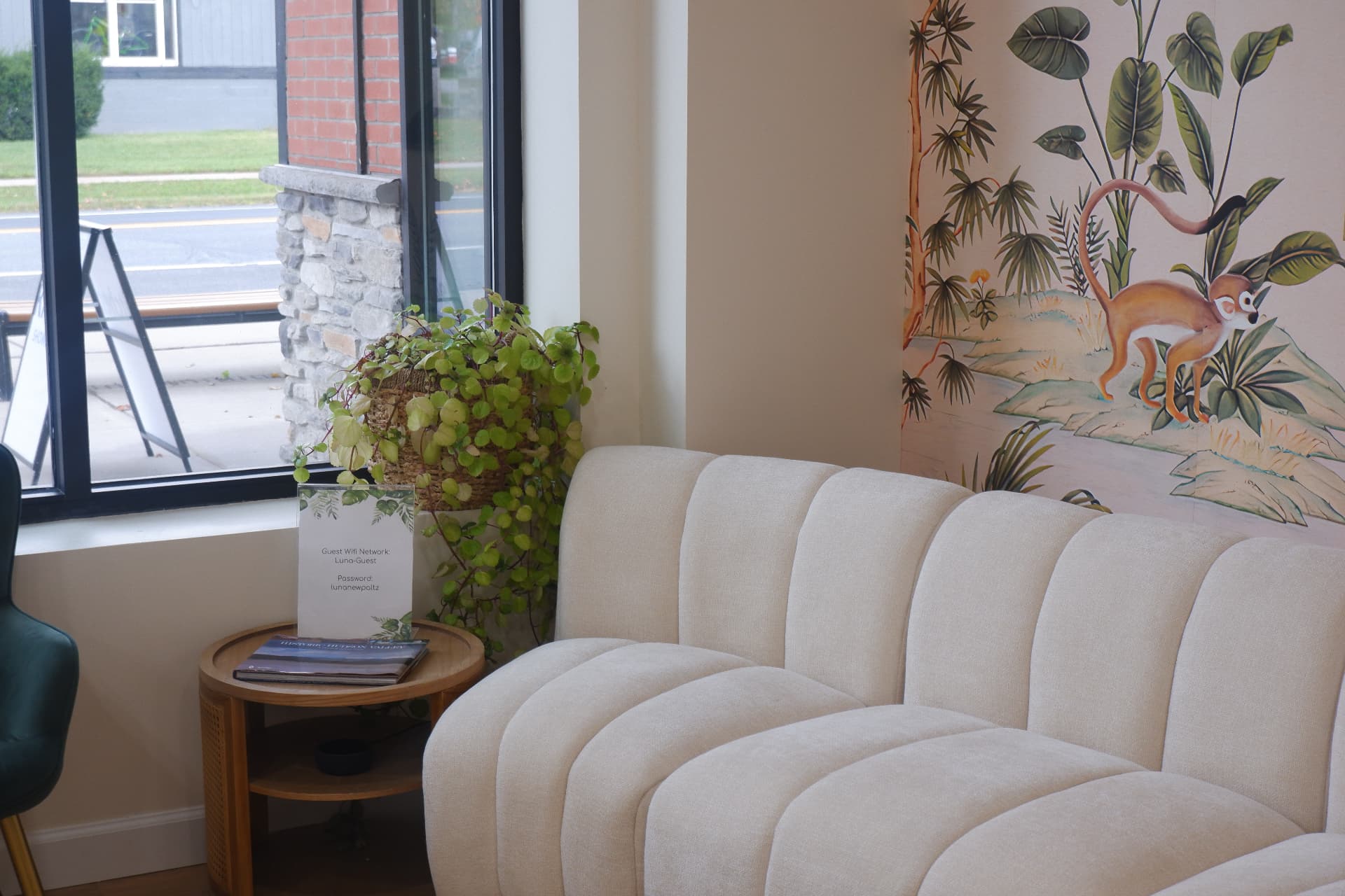 Sunlit lounge with botanical mural